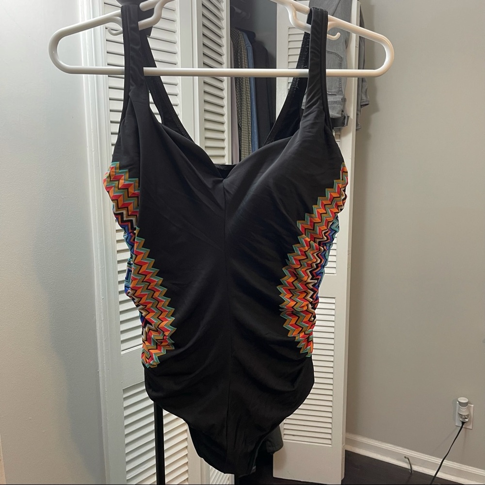 Miracle suit swim one piece.